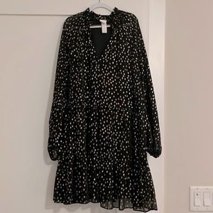 Chiffon black ruffled skirt dress with gold shimmery specks. Sheer sleeves.